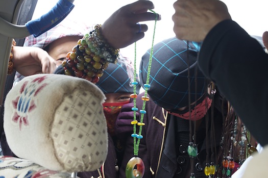 alt text of Tibetan Saleswomen with necklaces