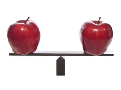 two apples on a balance beam