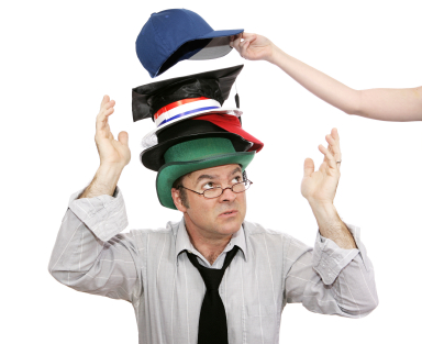 alt text for the image of a man wearing many hats