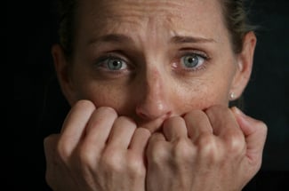 alt text for image of a frightened women