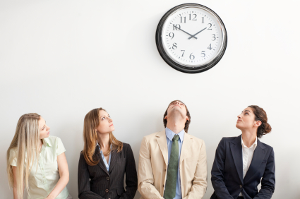 alt text for the iimage of four people watching the clock