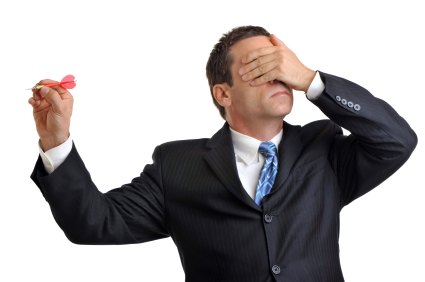 alt text for a man covering his eyes and throwing a dart
