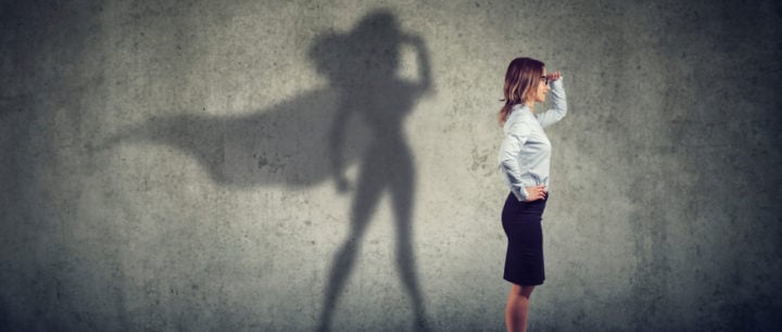 alt text image of business woman with a superhero shadow symbolizing power