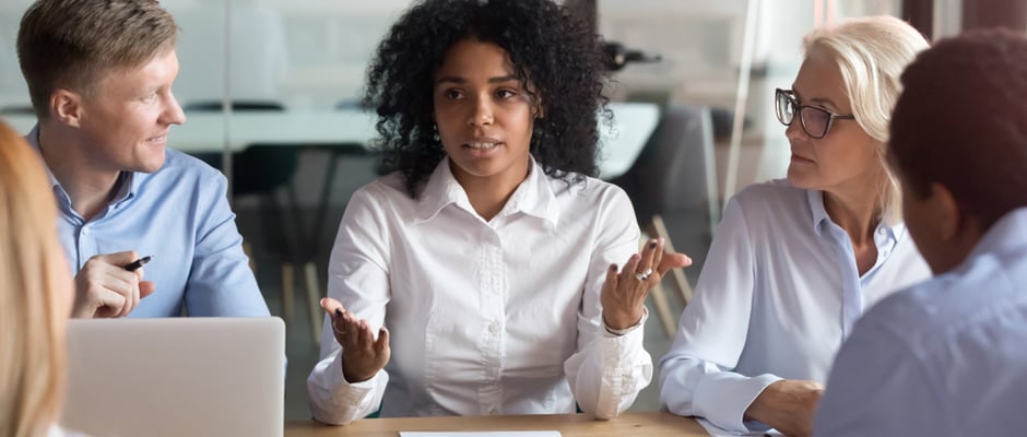 image of a client meeting at a conference table