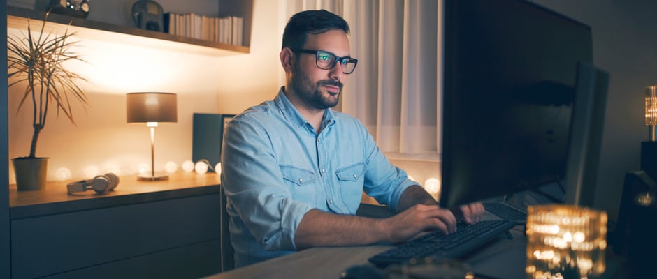 image of man working at a desk