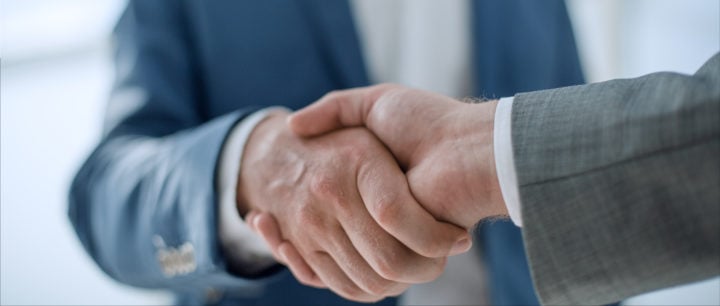two businessmen shaking hands