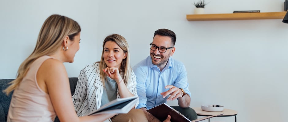 image of three people having a client meeting