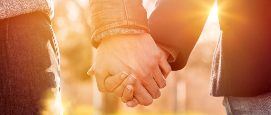 alt text image of two hands holding onto each other