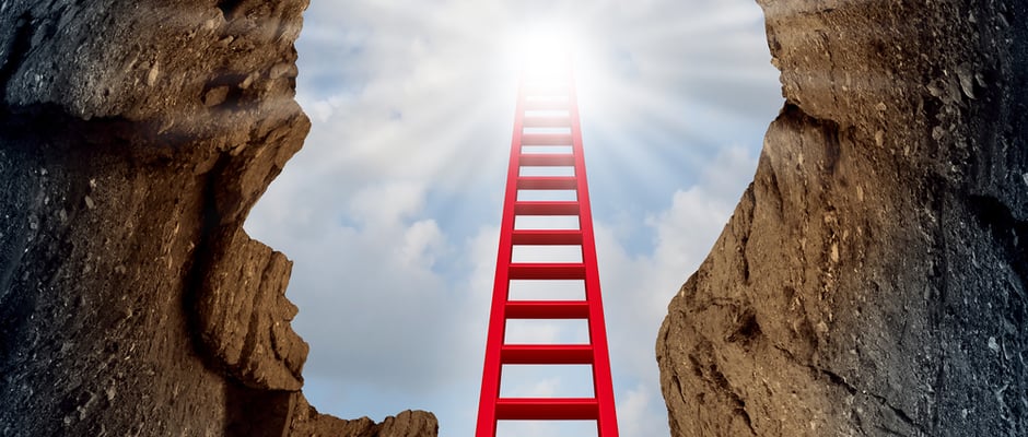 image of a deep mountain cliff shaped as a human head with a ladder leading to the outside towards a glowing sun as a psychology and mental health metaphor