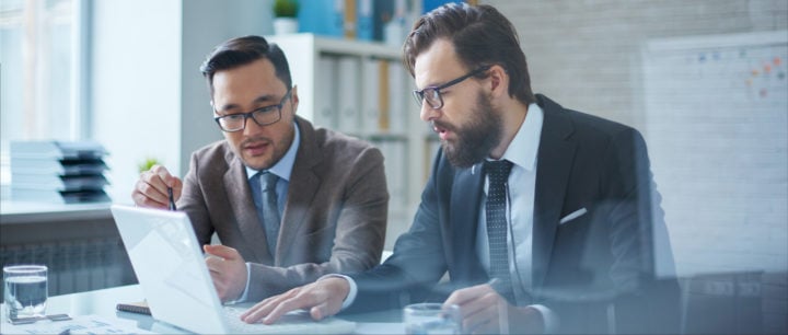 image of two businessmen working together