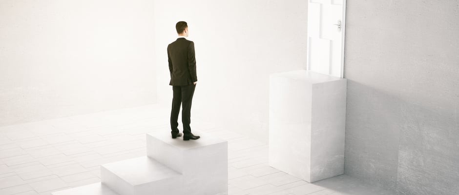 image of man missing a step a piece of flooring between him and a door