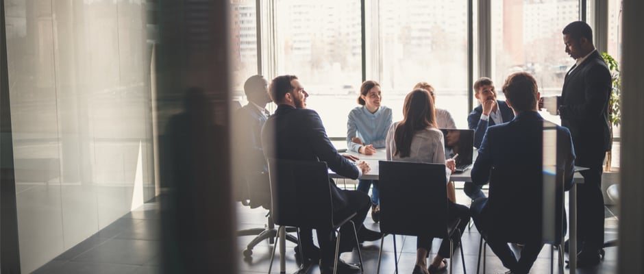 alt image text of people meeting around a conference table