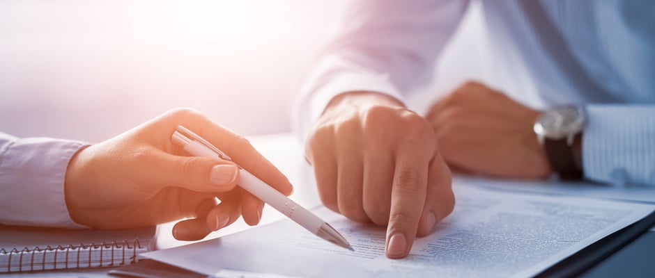 image of people signing a contract