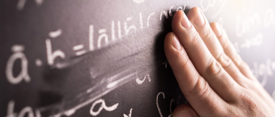 alt image text of a hand erasing a math problem off of a chalkboard