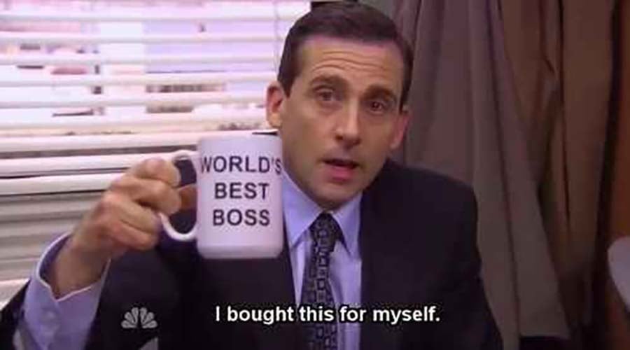 Michael Scott holding worlds best boss mug