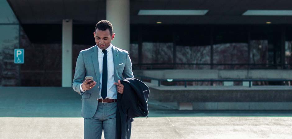 businessman-smiling-leaving-office