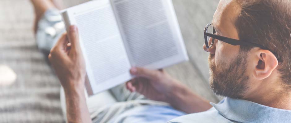 Man reading a paper book