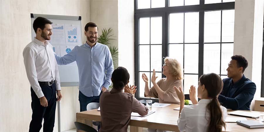 new employee being welcome by their team