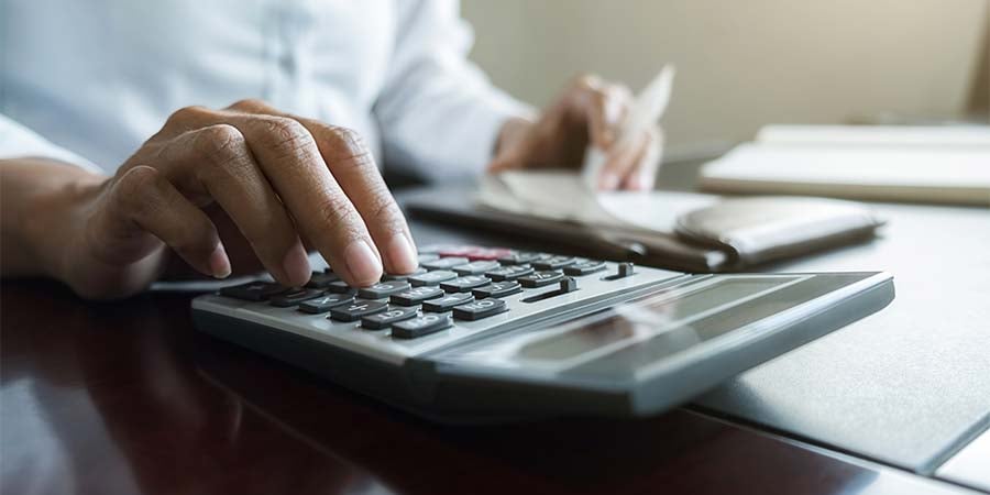 man using a calculator