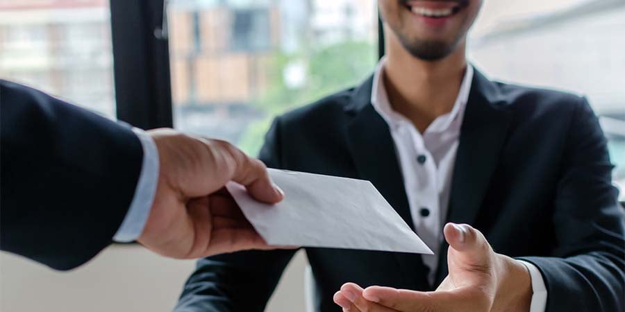 salesman receiving a bonus check