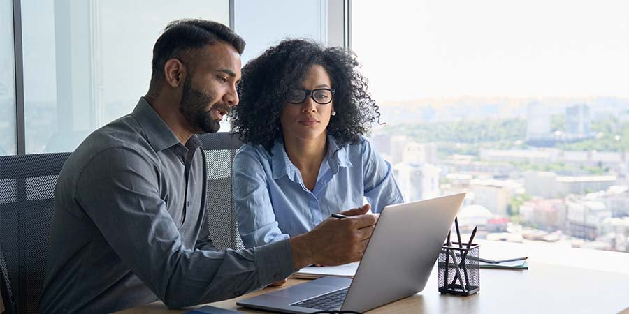 sales manager training a saleswoman