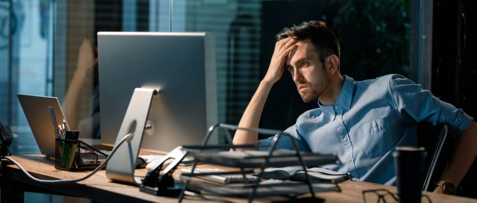 frustrated businessman at desk