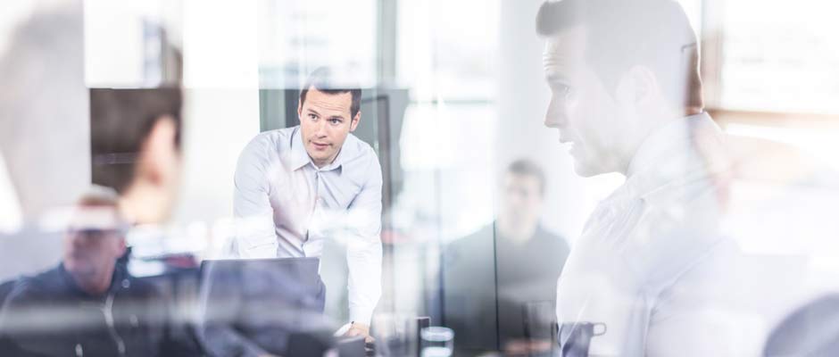 Salesmen in conference room