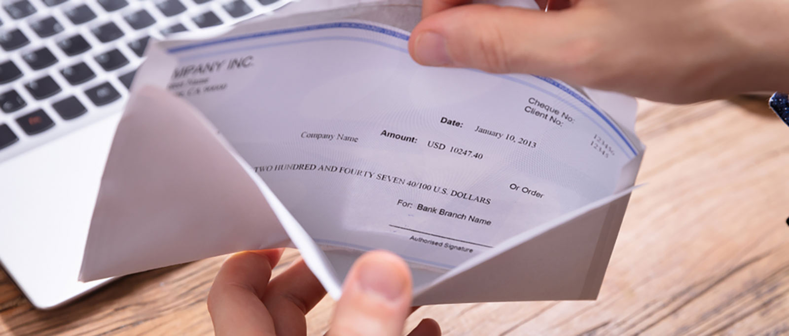 opening paycheck in an envelope