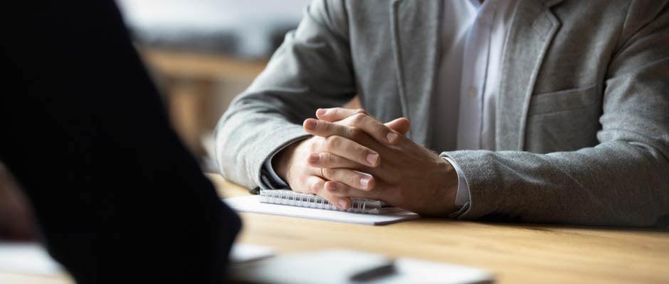 salesman with hands crossed