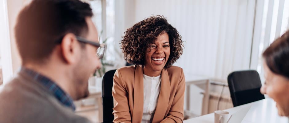 woman laughing in meeting