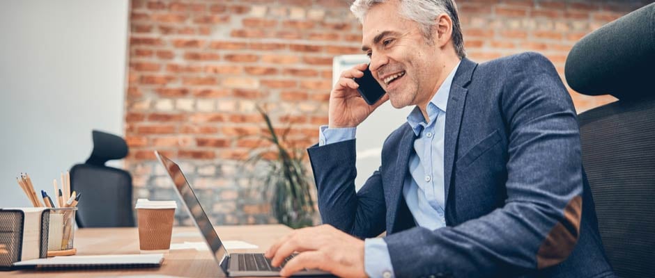 happy businessman on a cold call