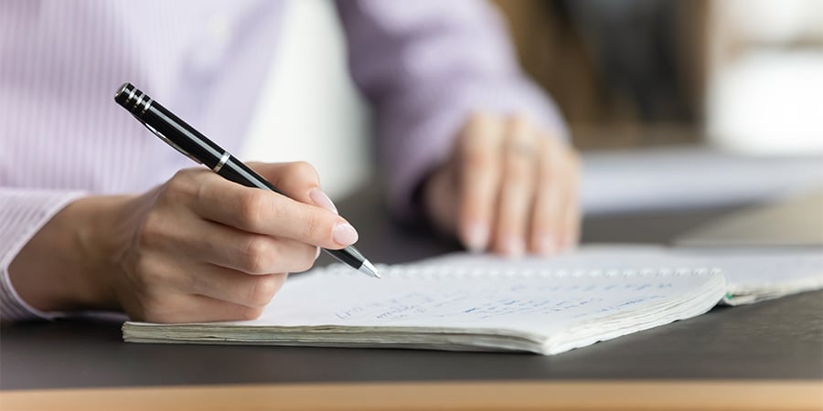 saleswoman taking notes