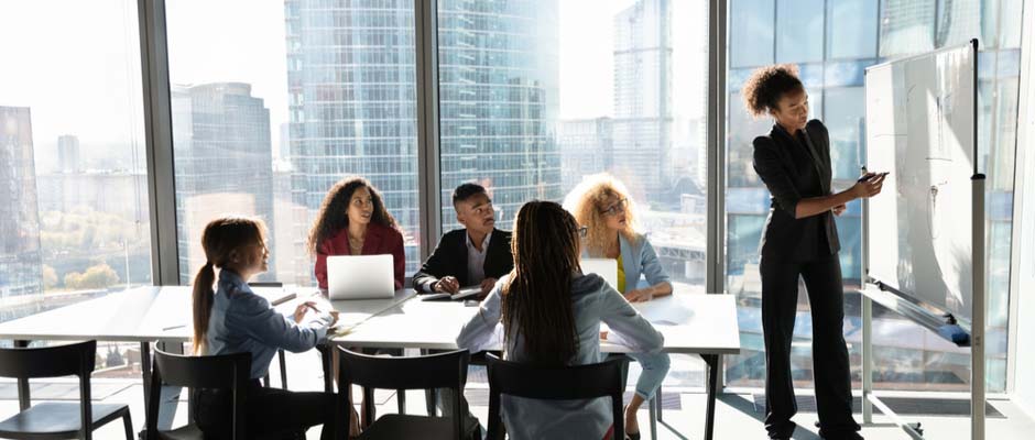 modern businesswoman presenting at white board