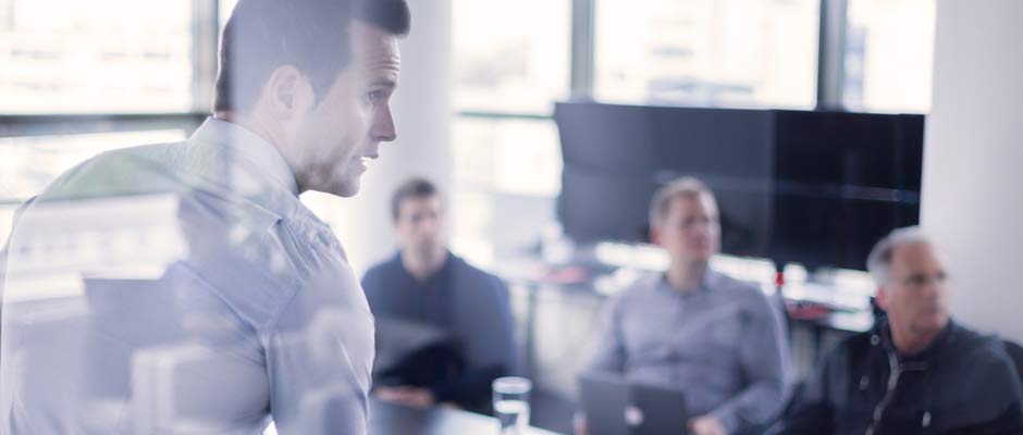 businessman standing in conference room