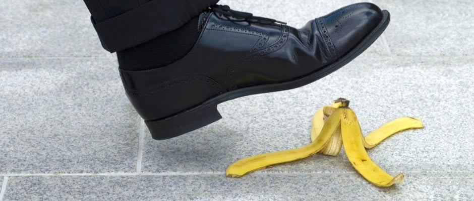 man stepping on banana peel