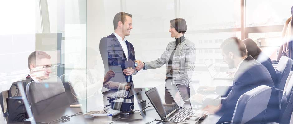 business man and woman shaking hands