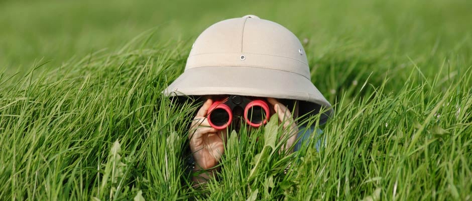 person with binoculars doing discovery