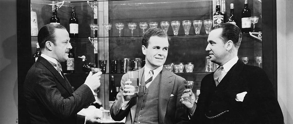 vintage businessmen having drinks