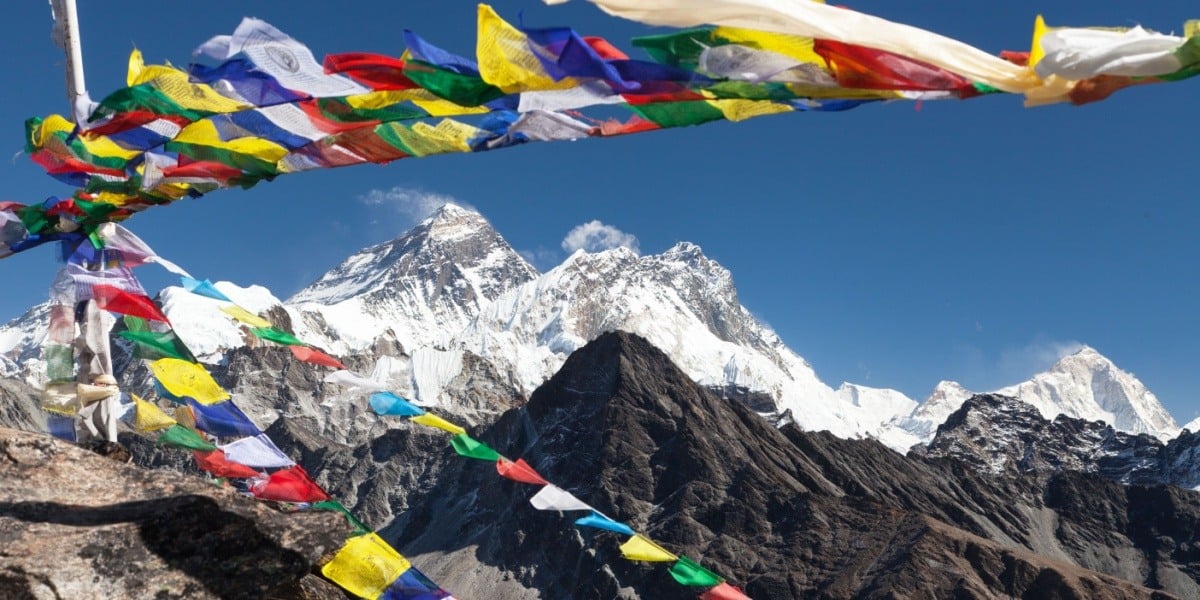 Mt. Everest with colorful flags in the foreground
