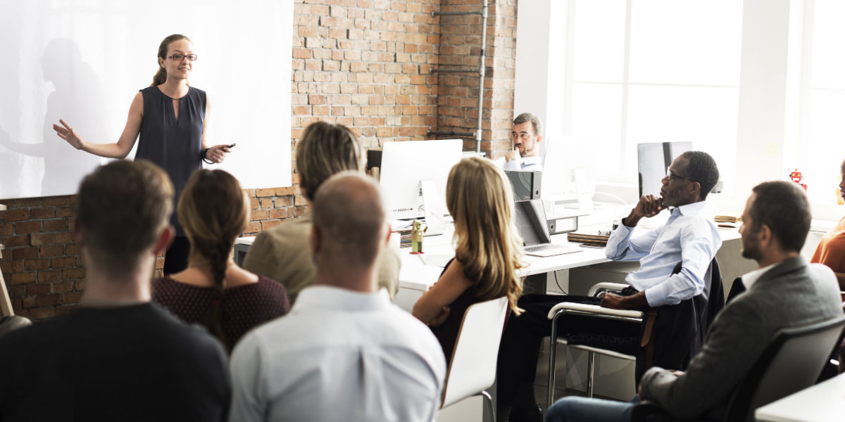Businesswoman leads sales training for team