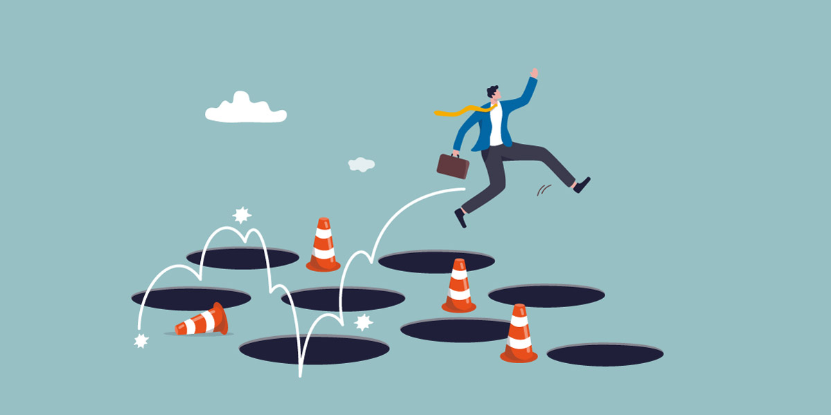 Illustration of salesman jumping to avoid pitfalls