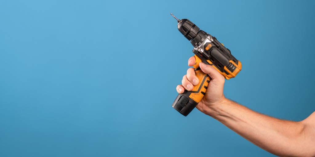 man holding drill