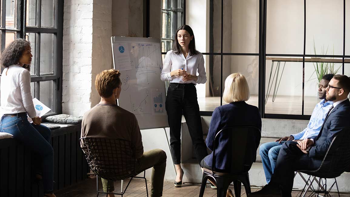 Woman sales leader meeting with her team