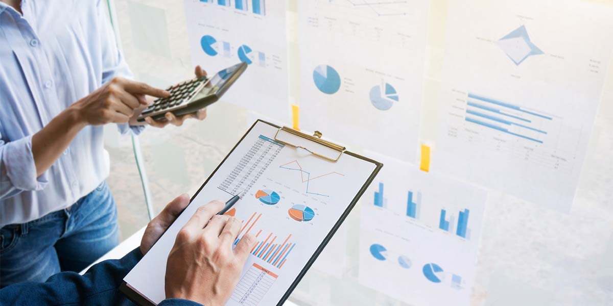 salespeople looking at performance charts