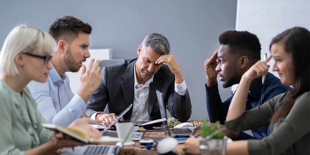 frustrated sales team arguing with one another