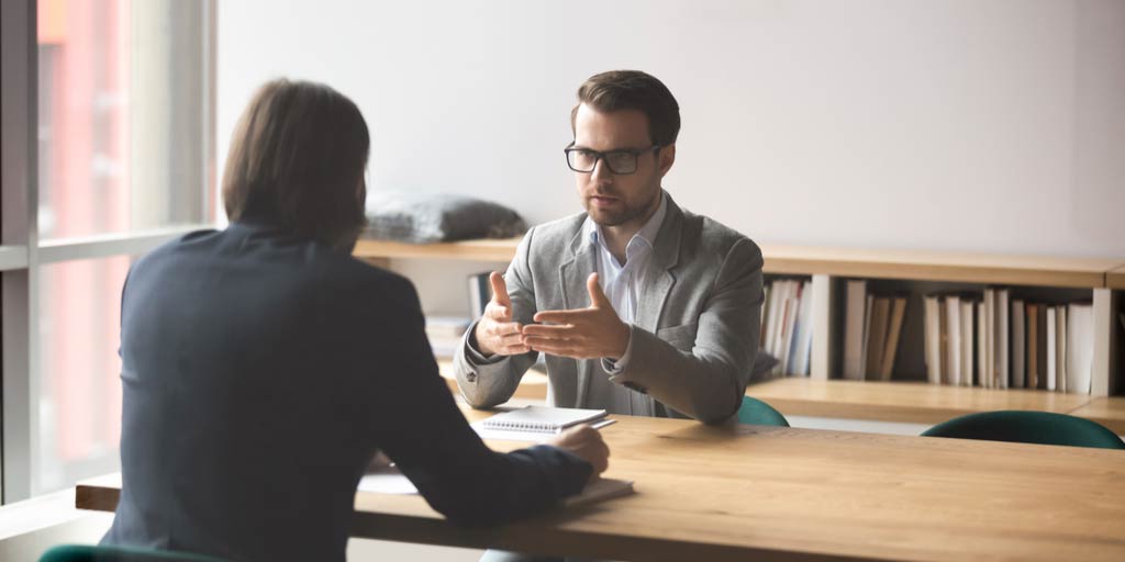 Salesman explaining something to client