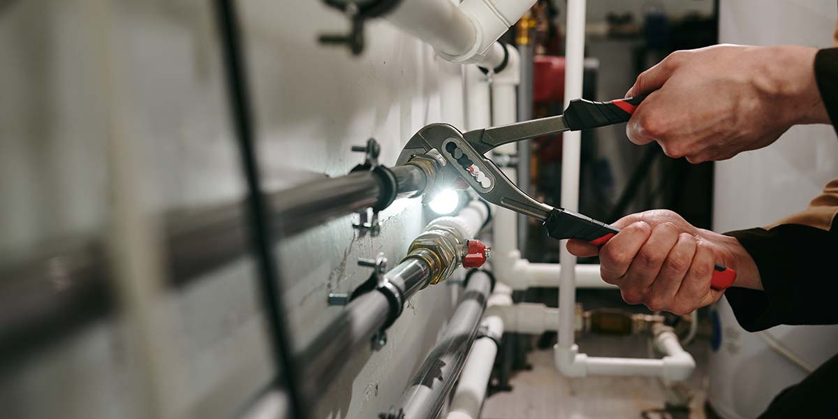 wrench turning on a broken pipe