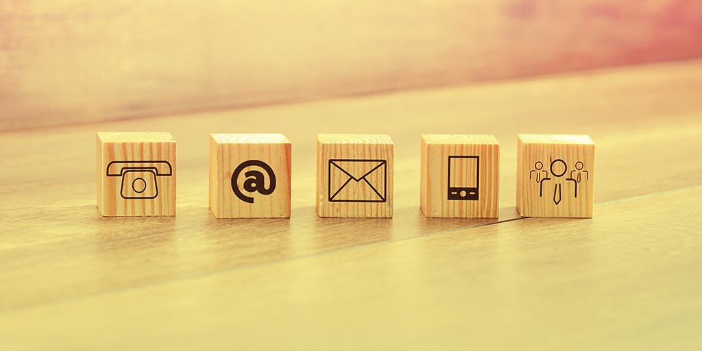 Close up Small Wooden Blocks with Assorted Communications Method Icons
