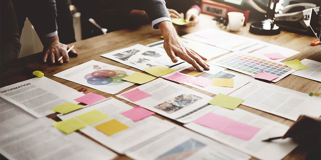 documents laid out on table for strategy planning