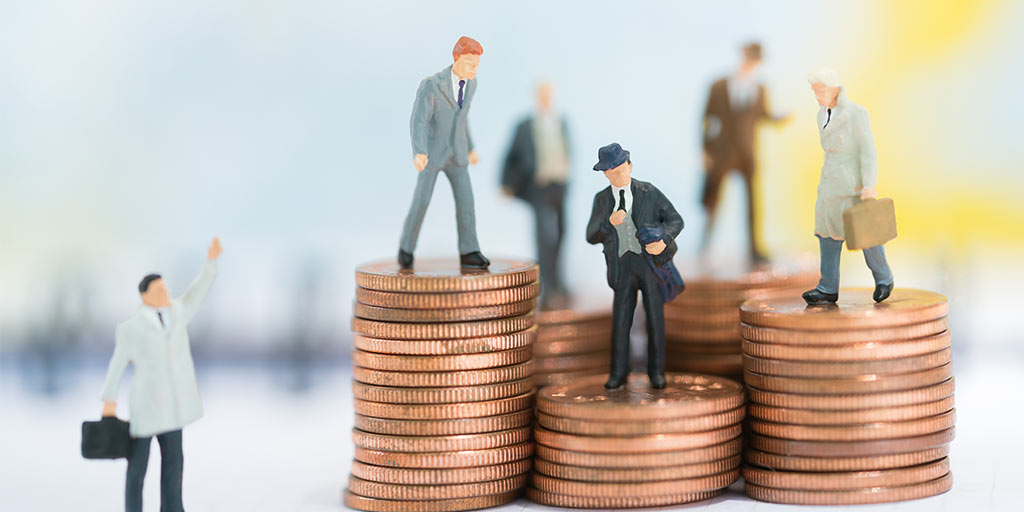 business figurines on gold coins